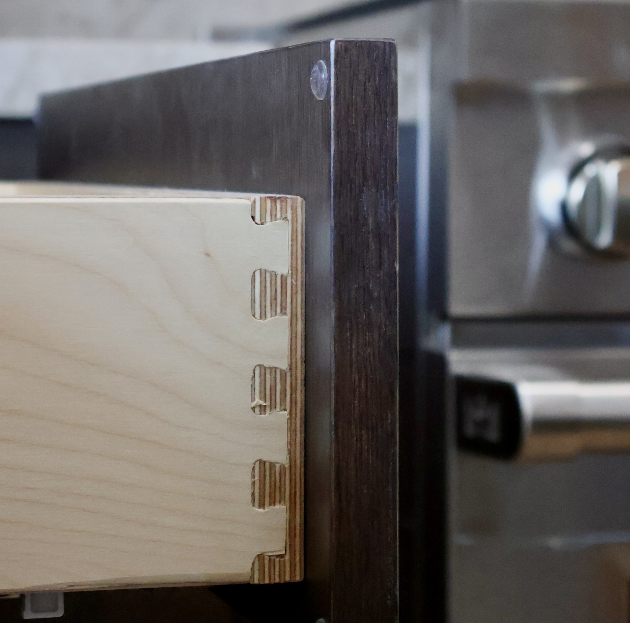 Custom cabinetry quality is revealed inside. Learn how materials, drawers, and hardware determine long-term performance.