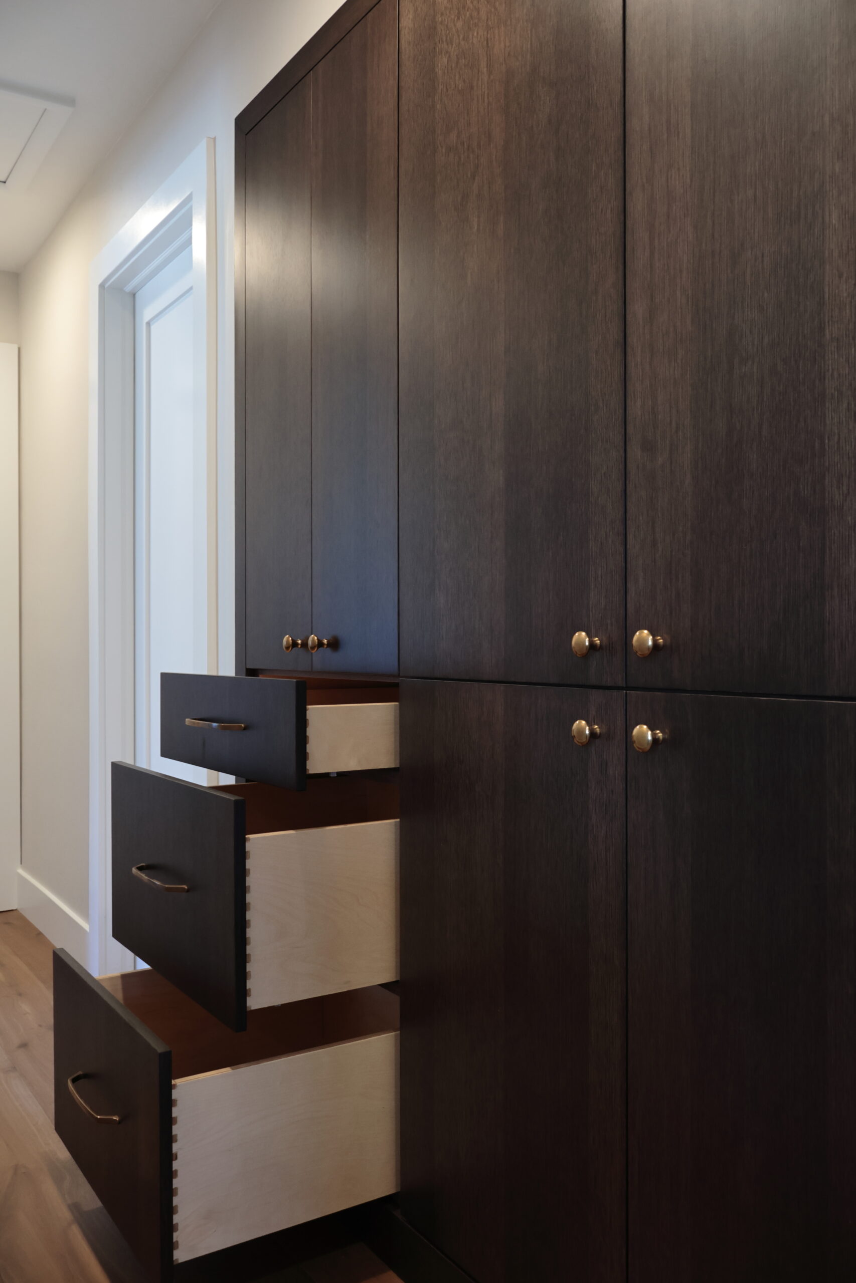 custom stained rift white oak, kitchen cabinets, designer kitchen with custom cabinetry, finish custom cabinets color matched to interior design, luxury kitchen with deep wood tone cabinetry, custom home construction, kitchen cabinetry detail, Euromax custom cabinets, close-up finish detail